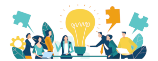 A group of people sit around a table discussing the pieces of a puzzle and their ideas.