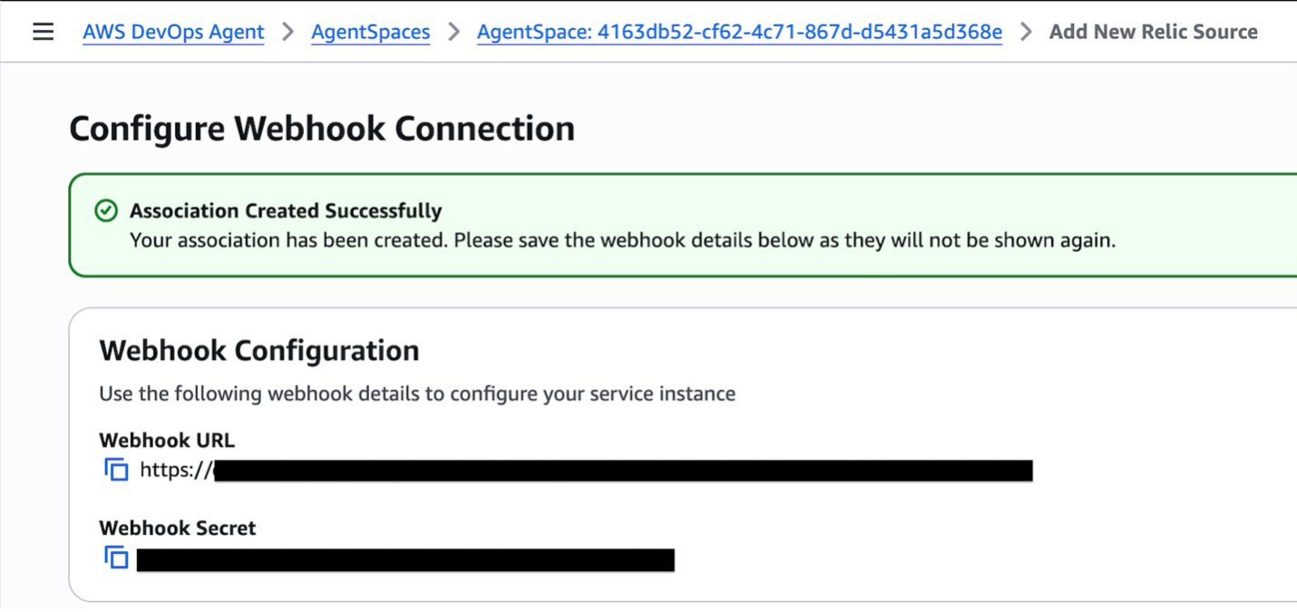Screen shot for Configure Webhook Connection displaying the Webhook URL and Webhook Secret, both are redacted by a black bar.