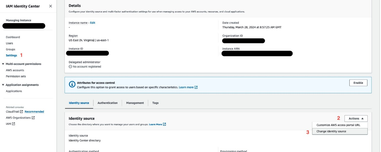 Screenshot of the IAM Identity Center settings page, with the "Change identity source" action selected from the dropdown menu.