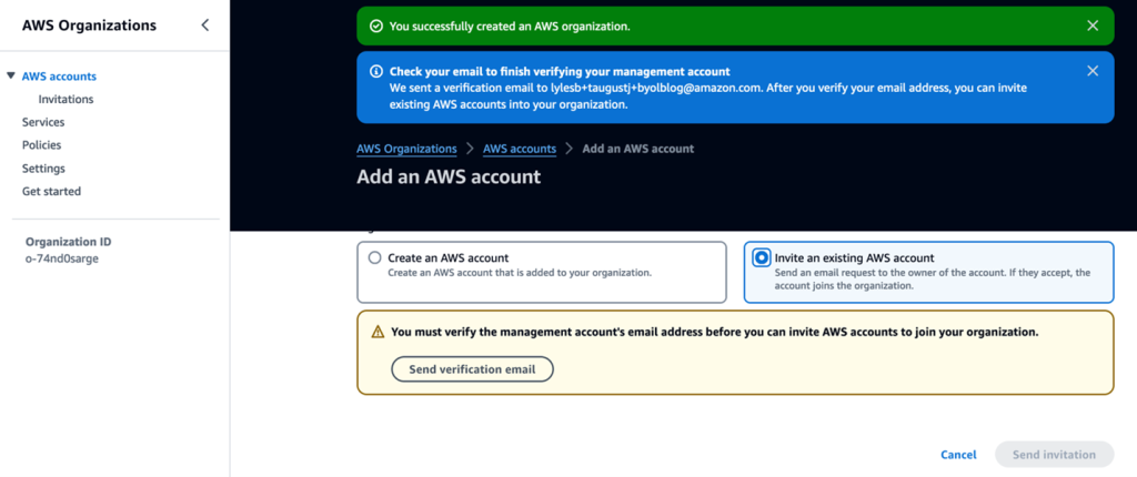 When creating an AWS Organization, you can invite existing accounts by sending a verification email by clicking Send verification email.