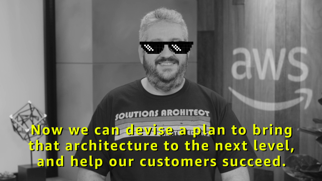 Raf teaching in a studio, wearing the funny pixelated sunglasses again, with a caption on the image that says “Now we can devise a plan to bring that architecture to the next level, and help our customers succeed.”