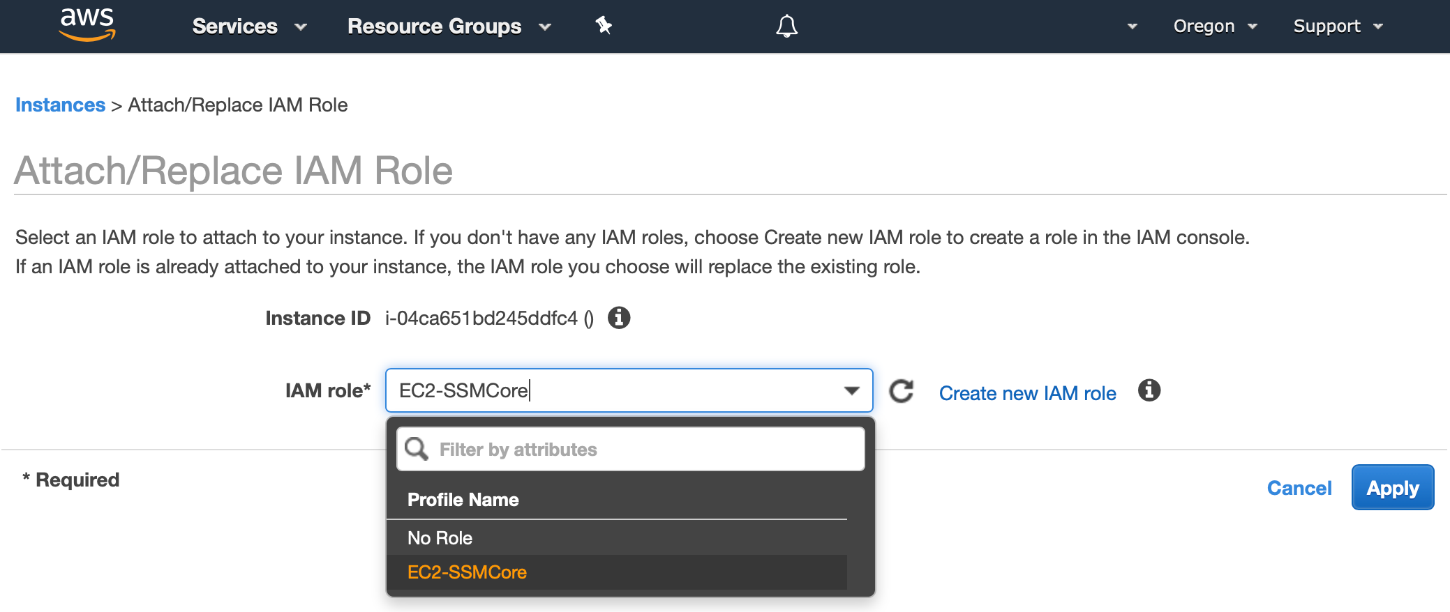 AWS Management Console shows the dialog to Attach/Replace IAM Role. The EC2-SSMCore role that was created in the last section is selected from a drop down box.