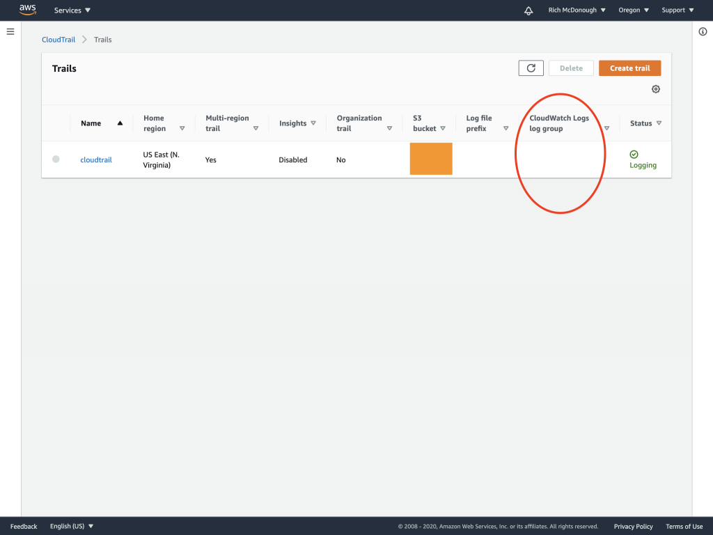 Trails page of the CloudTrail console includes a column for CloudWatch Logs log group.