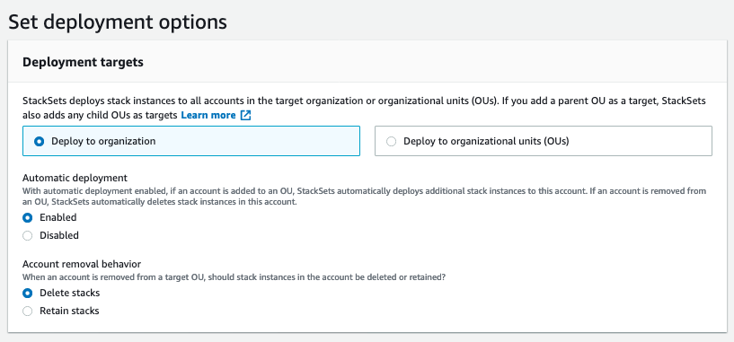Under Deployment targets, Deploy to organization is enabled. Under Automatic deployment, Enabled is selected. Under Account removal behavior, Delete stacks is selected.