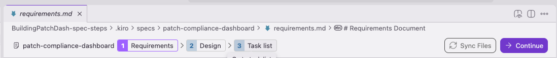 Image of the Kiro IDE showing a spec at patch-compliance-dashboard. The phase navigator at the top of the editor highlights three steps — Requirements, Design, Task list — with Requirements marked complete. A "Continue" button on the right are used to advance the spec to the Design phase.