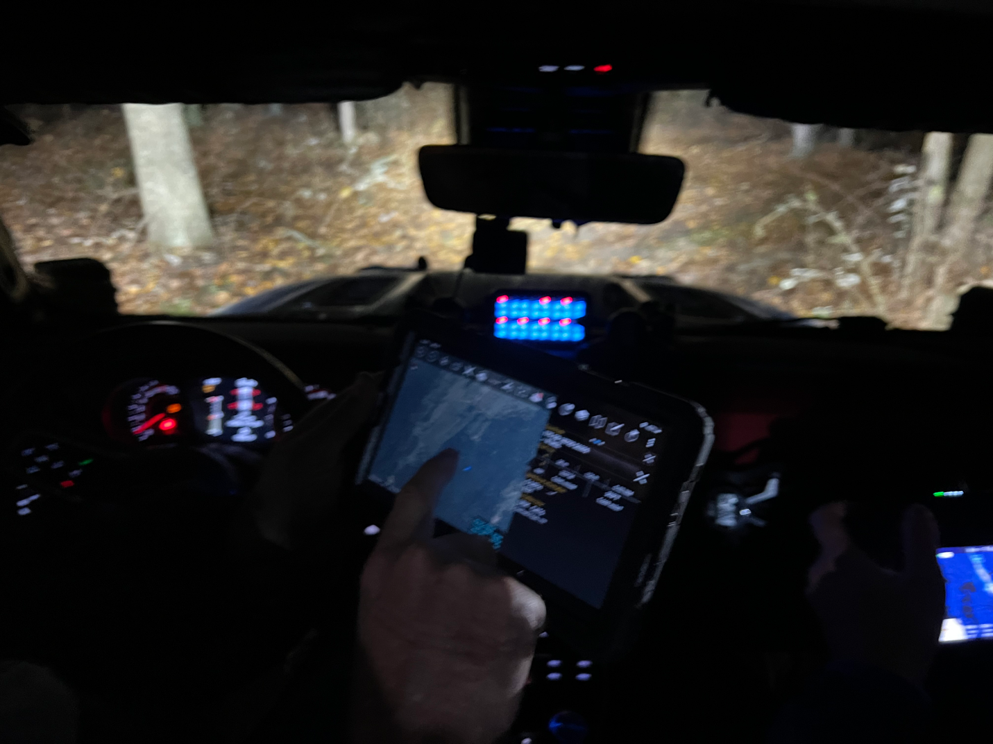 Figure 4. SAR team conducting search with an ATAK tablet displaying APRS, LoRaWAN, and drone data.