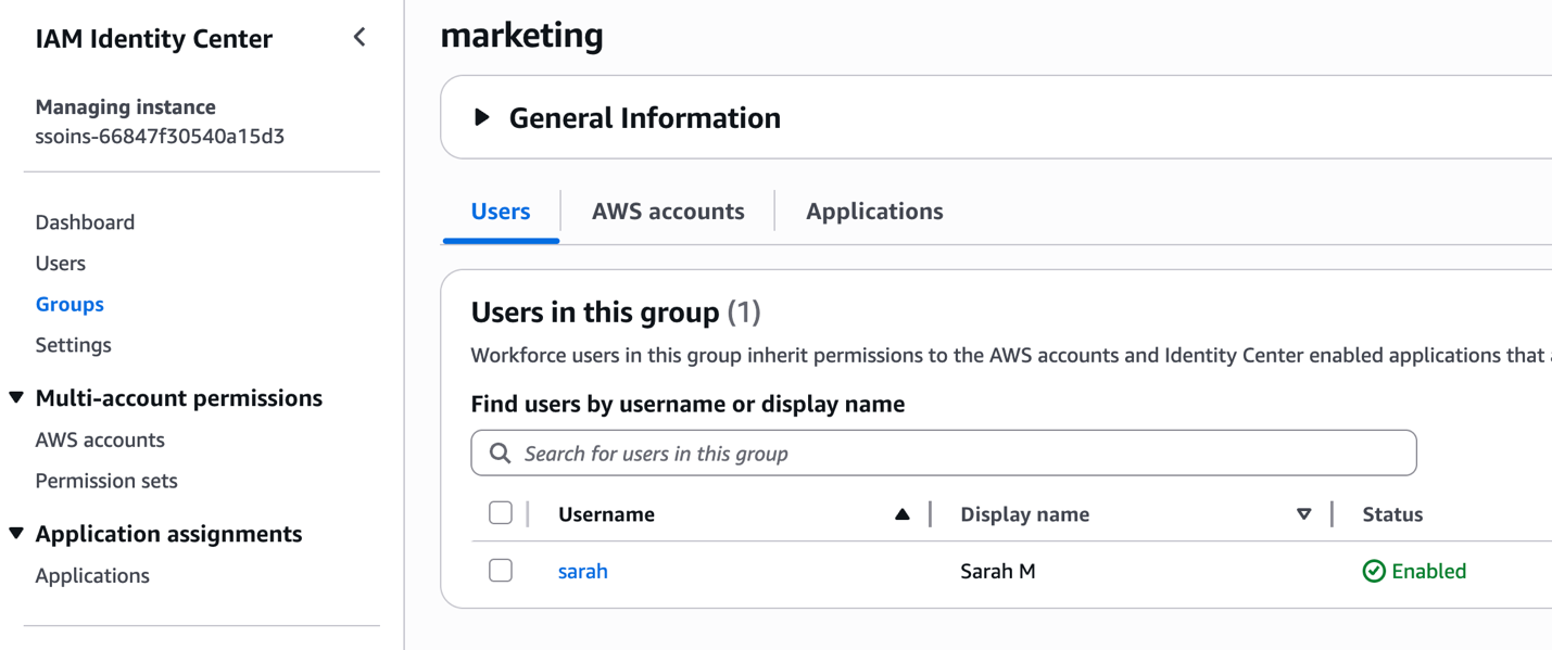 AWS IAM Identity Center console screenshot showing marketing group's Users tab with one enabled member (user sarah, Display name: Sarah M) who inherits permissions to AWS accounts and Identity Center enabled applications.