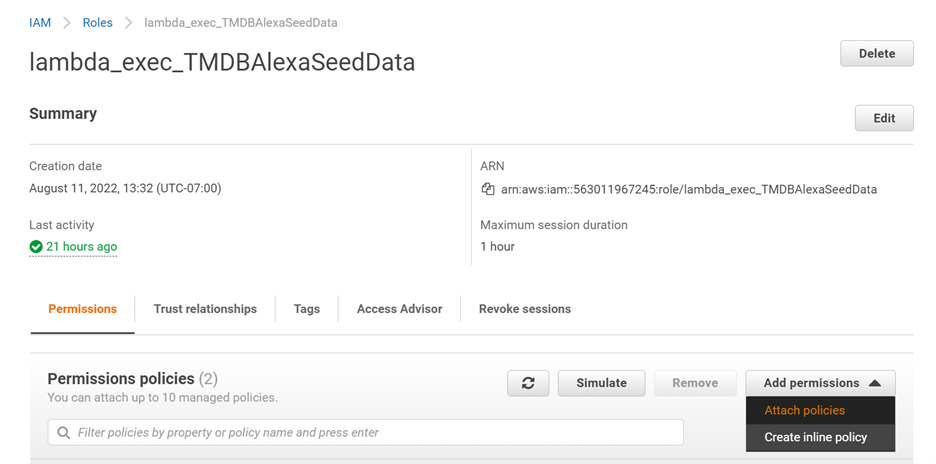 IAM Roles Section of AWS Console. Selected role is "lambda_exec_TMDBAlexaSeedData". Add permission dropdown opened with "attach policies" highlighted