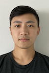Portrait photograph of a young Asian male in his twenties wearing a black t-shirt against a neutral gray background
