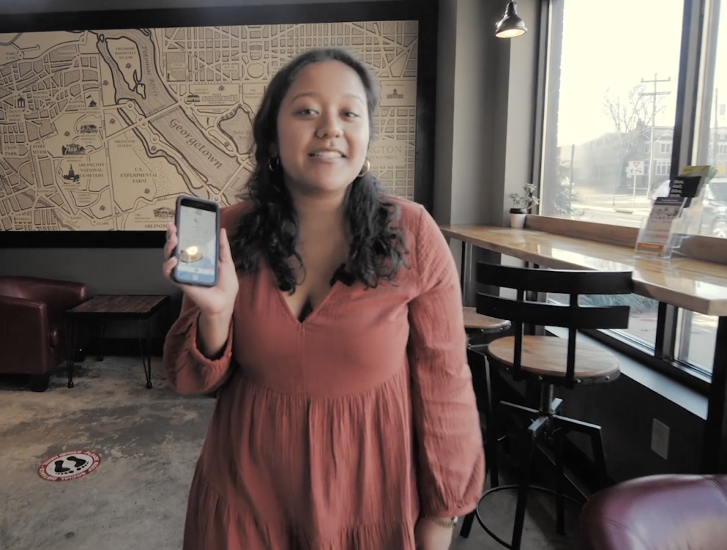 Member of Arlington Economic Development group showing how SMBs can connect to customers with smartphones