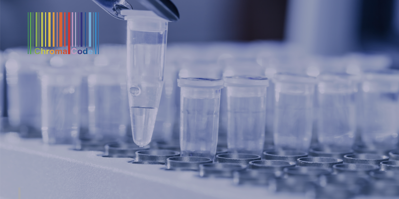 A close up of several rows of test tubes on a table with chromacode logo