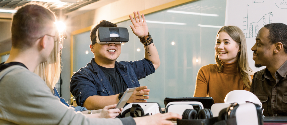 man wearing virtual reality goggles in meeting