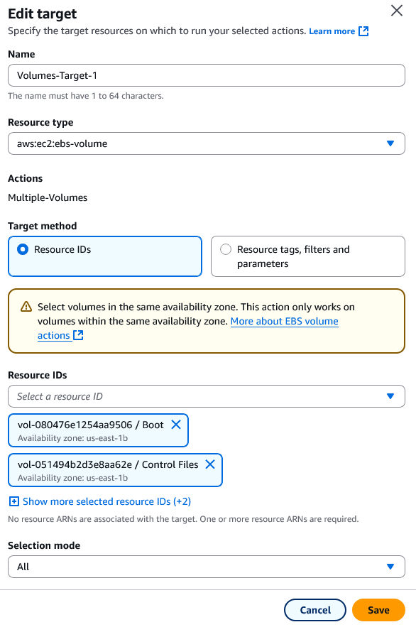 AWS Fault Injection Service target configuration screen displaying the 'Add target' form with name 'Volumes-Target-1', resource type 'aws:ec2:ebs-volume', action 'Multiple-Volumes', and two selected EBS volumes (boot and control files) in availability zone us-east-1b.