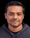 Professional headshot of Vineeth Harikumar, Principal Engineer at Amazon Health Services, wearing a dark gray hoodie.