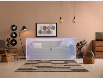 Contemporary home office setup with laptop and enlarged display screen surrounded by decorative furniture, brass pendant lights, framed geometric artwork, and minimalist aesthetic in warm neutral tones