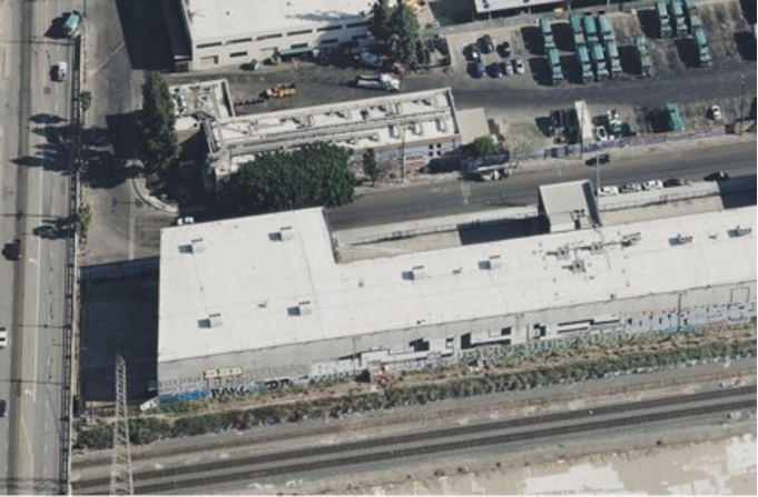 Oblique aerial image showing a building and surrounding area from an angled perspective