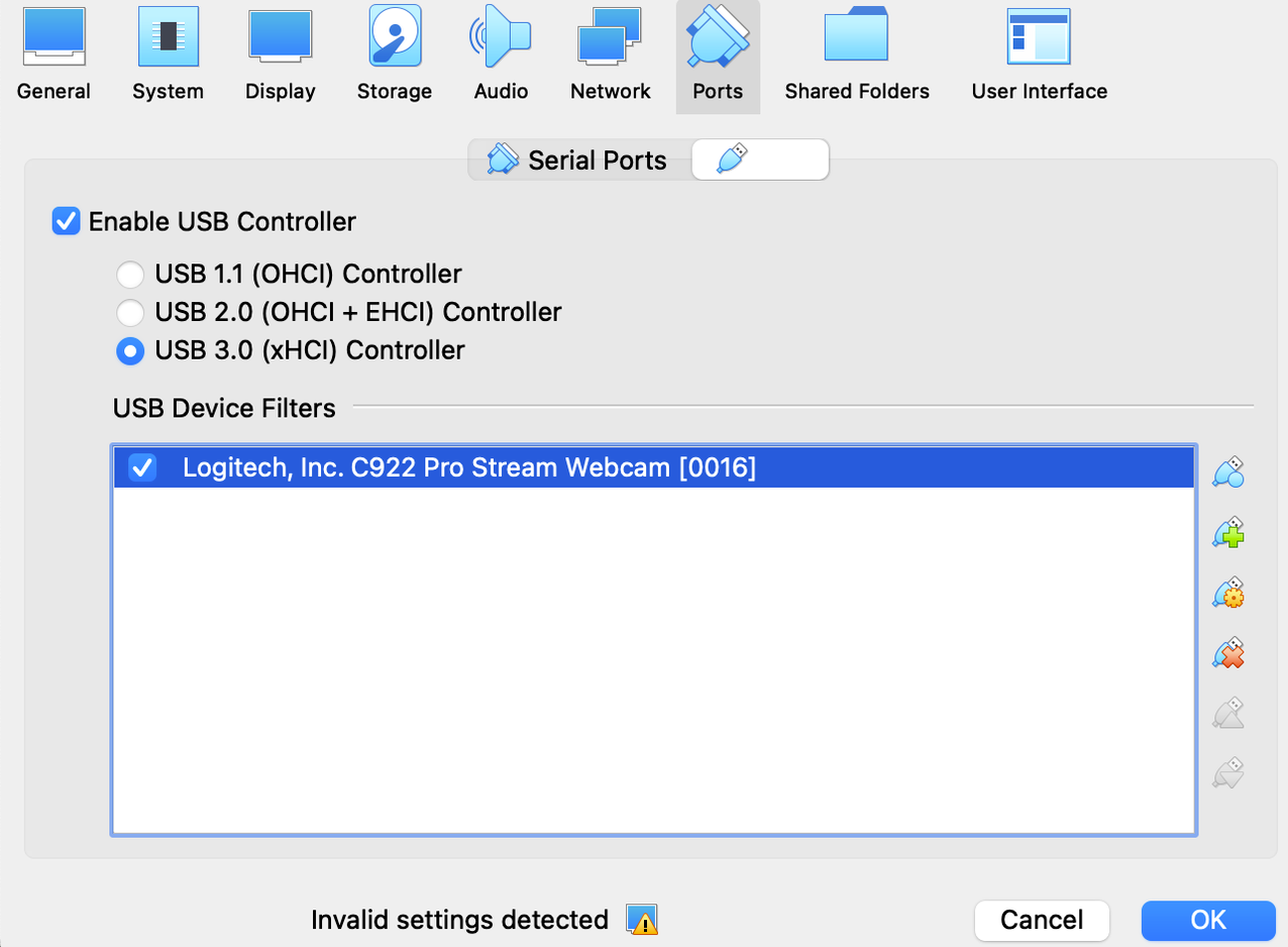 The VirtualBox GUI showing USB 3.0 enabled and the Logitech C922 camera in the allow list