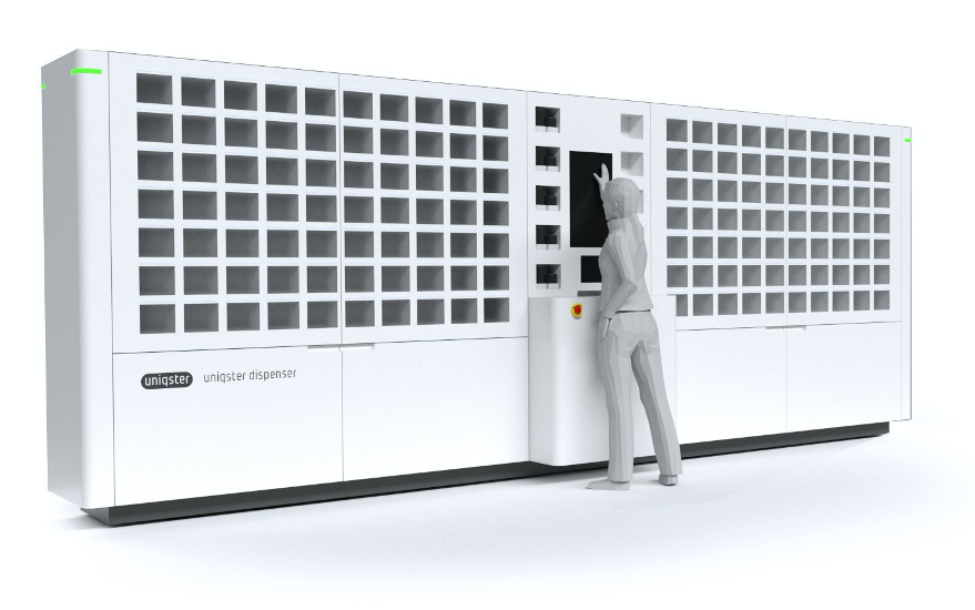 This is a model of a next generation pill-dispensing machine that can collect one or more pills from their primary containers placed in the square boxes and dispense them into a pouch into the central outlet.