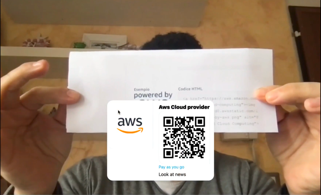 Person holding piece of paper with AWS logo, recognized.