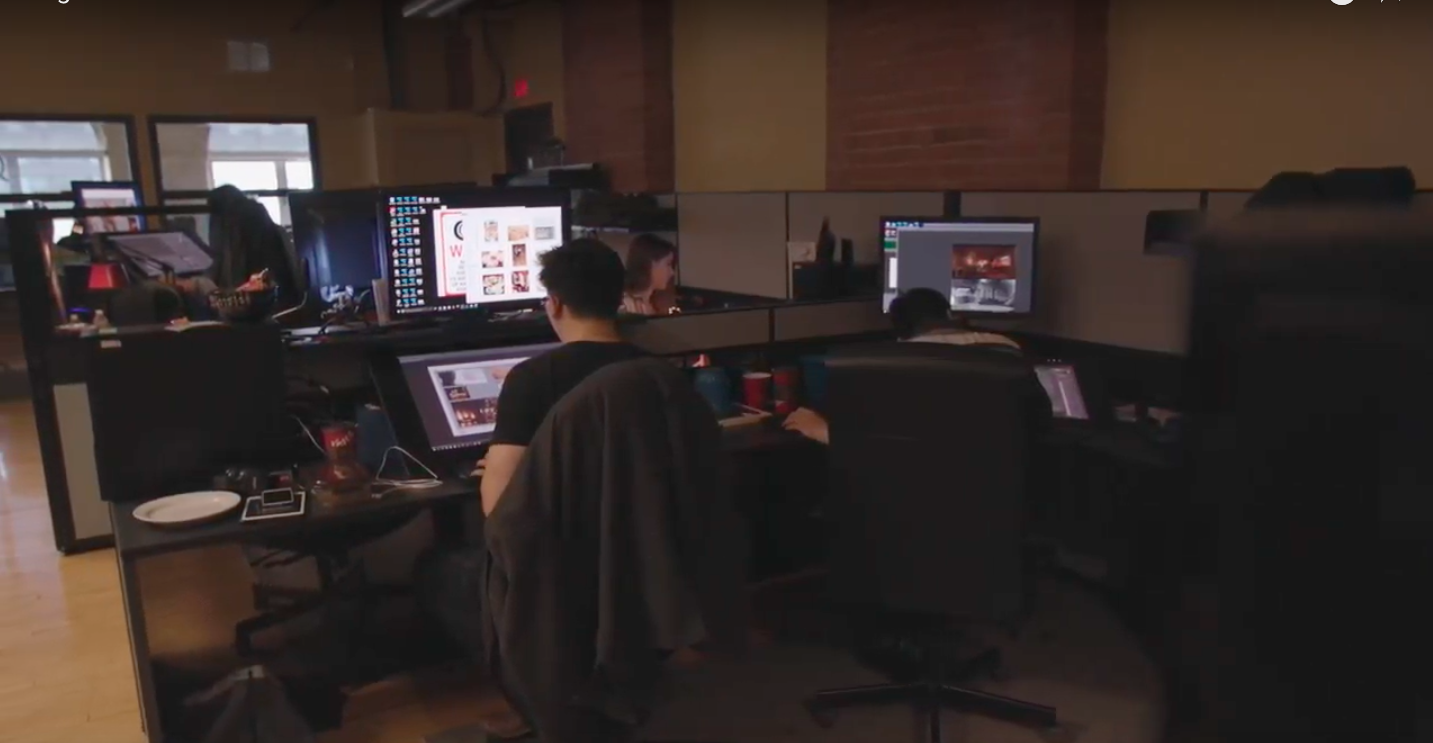 Tangent office. Artists at desks. 