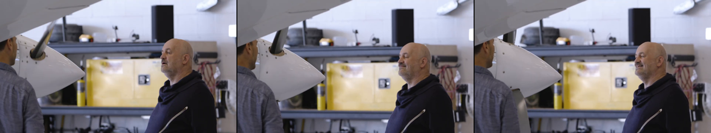An example of a video shot segment as a tiled image. The three images show two men talking in a workshop setting.
