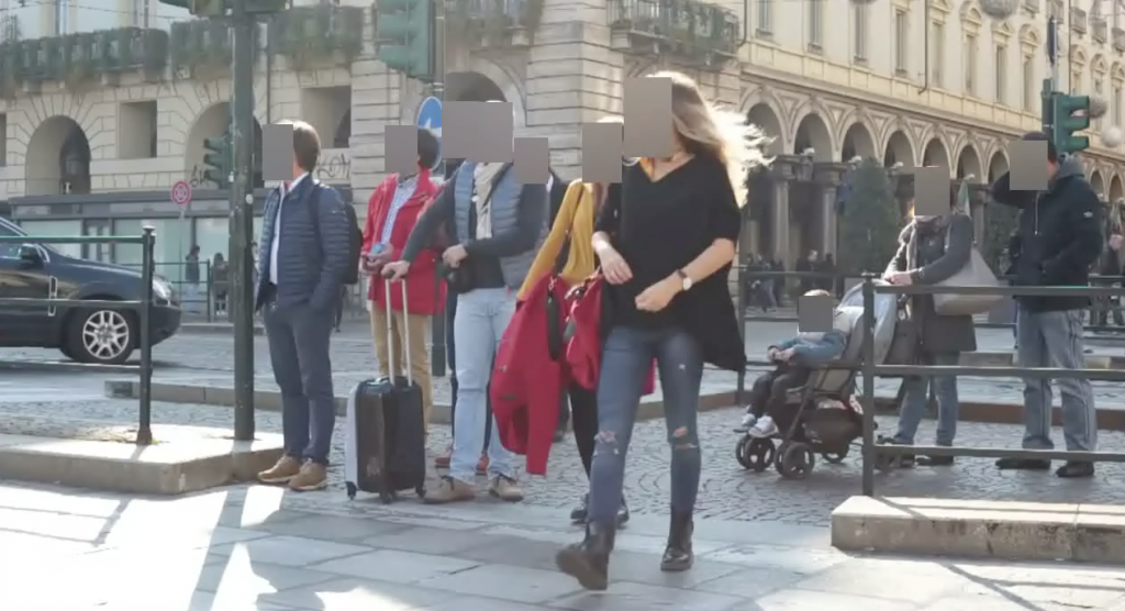 Video screenshot with faces of 5 people blurred